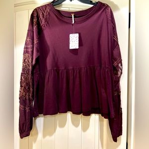Free People wine color top. Size small. New with tags.
